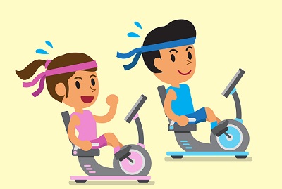 man and a woman riding recumbent exercise bikes